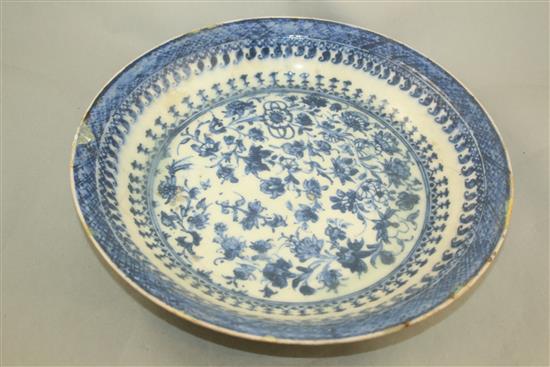 A Persian blue and white dish, Safavid, 17th century, 35cm, rim chips, restored